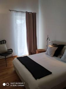 a bedroom with a large bed and a window at Casa Martina, Confort e Relax a due passi da Cividale in Cividale del Friuli