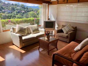 Khu vực ghế ngồi tại Villa para 20 personas, alberca y jacuzzi
