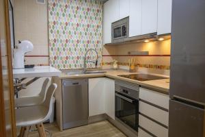 Kuchyň nebo kuchyňský kout v ubytování Apartamento Fuentesal