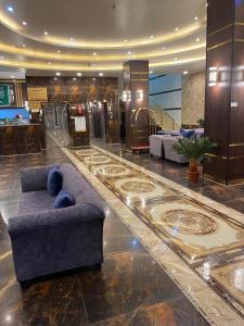 a lobby with a couch in the middle of a building at شقق راحتي جازان للشقق المخدومة in Jazan