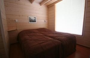 Krevet ili kreveti u jedinici u objektu Haarusmaa Holiday Apartments Kauhava