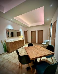 a large room with a wooden table and chairs at BenDorma in Hannover