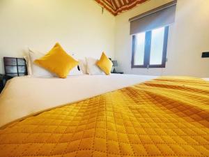 Voodi või voodid majutusasutuse Cattle Inn Resort - Luxury Cottages Pushkar toas