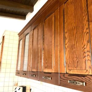 a bunch of wooden cabinets in a kitchen at Al chiaro di luna in Catania