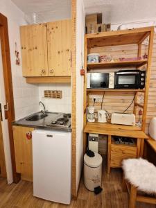 a small kitchen with a sink and a refrigerator at Chalet Club - Studio 2/3 personnes 17 m² MAE-2987 in Modane