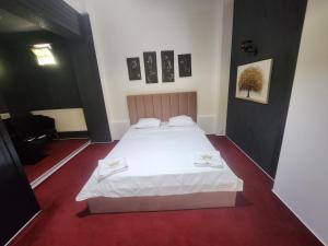 Postel nebo postele na pokoji v ubytování Karma