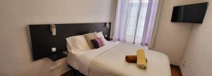 Cama ou camas em um quarto em Guesthouse of Alcobaça