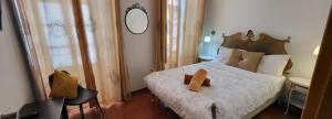 Cama ou camas em um quarto em Guesthouse of Alcobaça