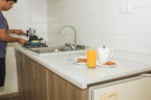 Kuchyň nebo kuchyňský kout v ubytování Riomar Apart Hotel
