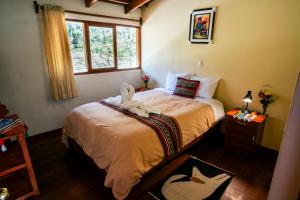 Postel nebo postele na pokoji v ubytování PERU QUECHUA'S LODGE Riverside + 26 fotografií