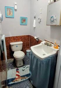 a bathroom with a sink and a toilet at Casa CAMPO Privada Con Piscina in Barceloneta +9 photos