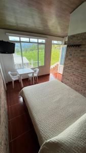 Postel nebo postele na pokoji v ubytování Hotel Paraíso Moniquira