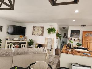 a living room with a couch and a table at The Coastal Comfort in Oxnard