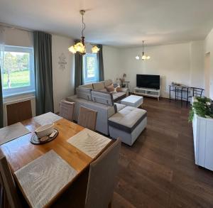 a living room with a table and a couch at Annie's apartment in Rakovica