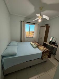 a bedroom with a large bed and a window at Bela Providência in Aracaju +34 photos