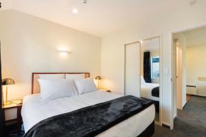 Postel nebo postele na pokoji v ubytování Daffodil Motel
