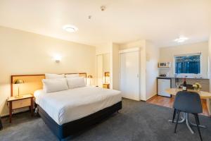 Postel nebo postele na pokoji v ubytování Daffodil Motel