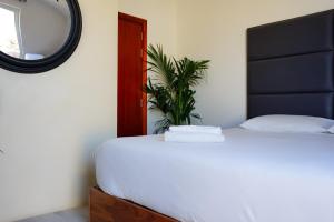 Postel nebo postele na pokoji v ubytování Valhalla Boutique Hotel