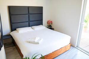 Postel nebo postele na pokoji v ubytování Valhalla Boutique Hotel