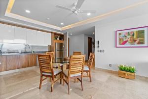 a kitchen and dining room with a table and chairs at Blue Horizon Luxury Condo in Puerto Vallarta