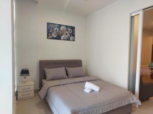 Postel nebo postele na pokoji v ubytování The Shore Kota Kinabalu City Centre By San's Suites + 12 fotografií