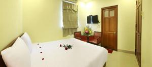 Rúm í herbergi á Danang Classic Hotel