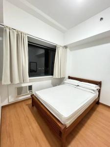 Katil atau katil-katil dalam bilik di Budget Family Room at Ace Suites by the Famous Indoor Water Spa