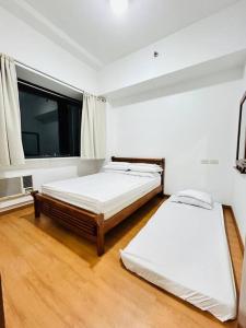 Katil atau katil-katil dalam bilik di Budget Family Room at Ace Suites by the Famous Indoor Water Spa
