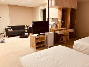 Rúm í herbergi á Chao Zhou 86 B&B
