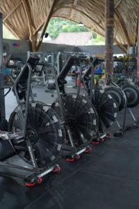 a row of bikes on display in a gym at Flora Villa Priv Pool By Yemaya in Kuta Lombok