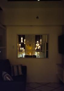 a living room with a view of a room with a mirror at Stefan's Cozy Place in Agus +34 photos