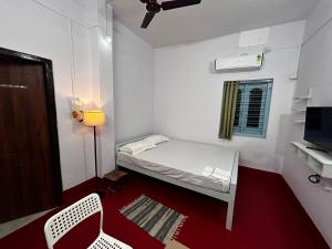 Raj Andar Guest House客房内的一张或多张床位