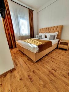 Postel nebo postele na pokoji v ubytování Laura Apartments Sinaia