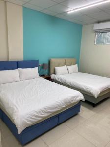 Rúm í herbergi á Luyu Homestay