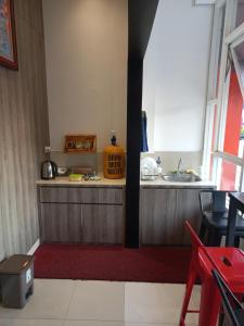 A kitchen or kitchenette at The Cabin Tanjung Yogyakarta