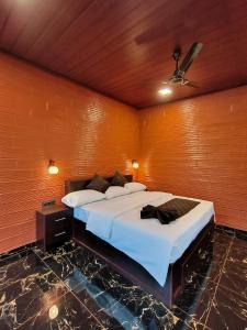 Postel nebo postele na pokoji v ubytování Betel Brooks Resort + 6 fotografií