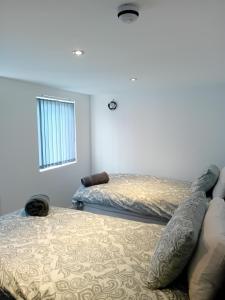 Ένα ή περισσότερα κρεβάτια σε δωμάτιο στο Windies apartment 4
