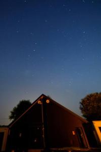 a truck parked under a night sky with stars at Starry Sky Cottage 17 in Bihoro