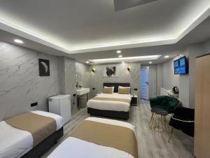Postel nebo postele na pokoji v ubytování White Palace Haliç