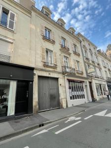 a building on the side of a street at Grand loft 110m Cœur historique Angers et parking privé Rare in Angers