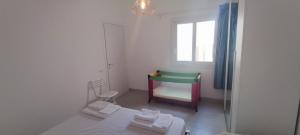 Postel nebo postele na pokoji v ubytování Donna Beatrice aMare beach house