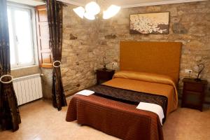 Un pat sau paturi într-o cameră la Casa Nunes