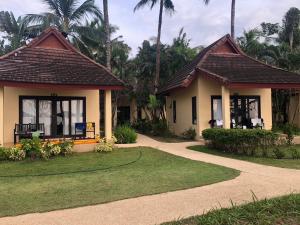 a house with a pathway leading to it at Nang Thong Beach Resort in Khao Lak
