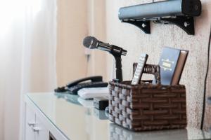 a microphone on a table with a basket on it at Tagaytay Overlooking Taal. Free Parking Fast Wi-Fi in Tagaytay