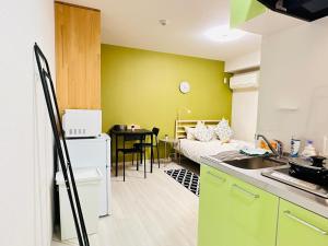a room with a kitchen and a living room at home鶴見橋 in Osaka