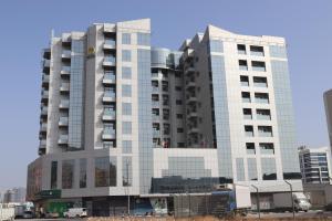a tall building with a lot of windows at TIME Onyx Hotel Apartments in Dubai