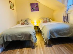 Postel nebo postele na pokoji v ubytování Worcester Homestay