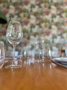 a group of wine glasses sitting on a table at Belfast Skyline Retreat - 3 Bedroom Apartment with Free Parking in Belfast