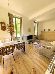 TV a/nebo společenská místnost v ubytování Appartement Bellevue du Ventoux