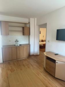 a kitchen with a sink and a counter in a room at Sun City Hotel in Sunny Beach